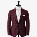 Red plaid suit jacket on a mannequin with a white shirt underneath on a white background